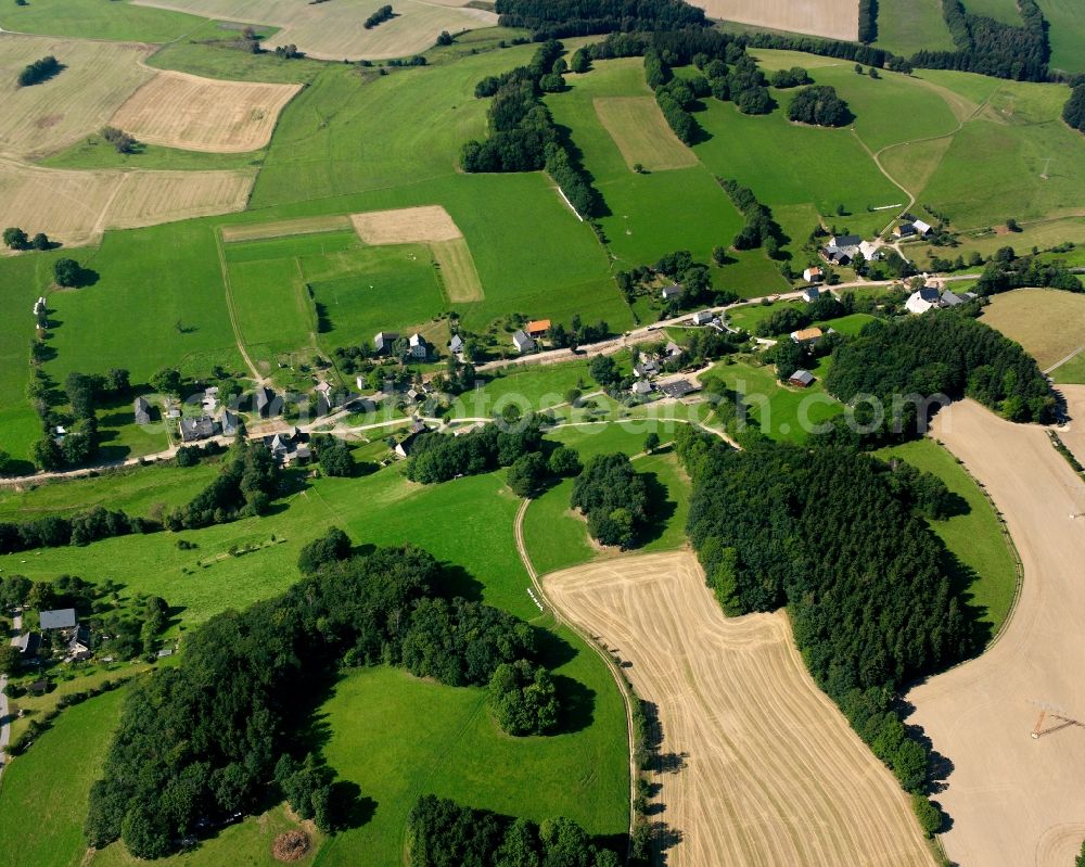 Zethau from above - Agricultural land and field boundaries surround the settlement area of the village in Zethau in the state Saxony, Germany