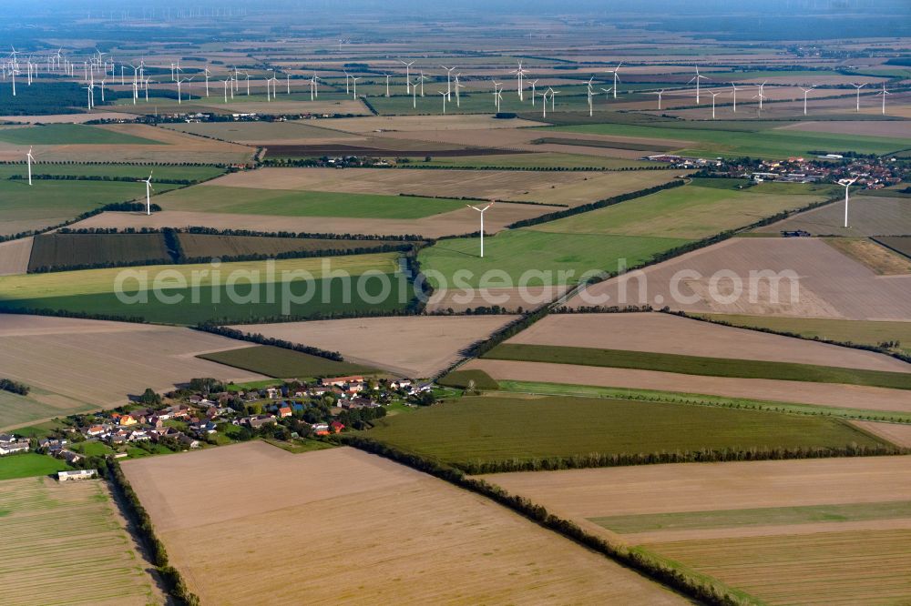 Zeuden from above - Agricultural land and field boundaries surround the settlement area of the village in Zeuden in the state Brandenburg, Germany