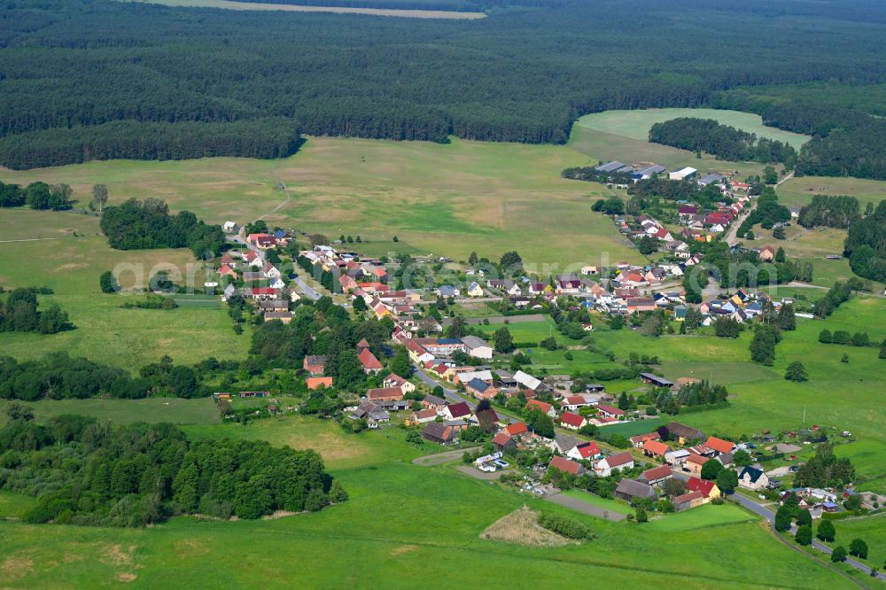 Aerial image Zühlen - Agricultural land and field boundaries surround the settlement area of the village in Zühlen in the state Brandenburg, Germany