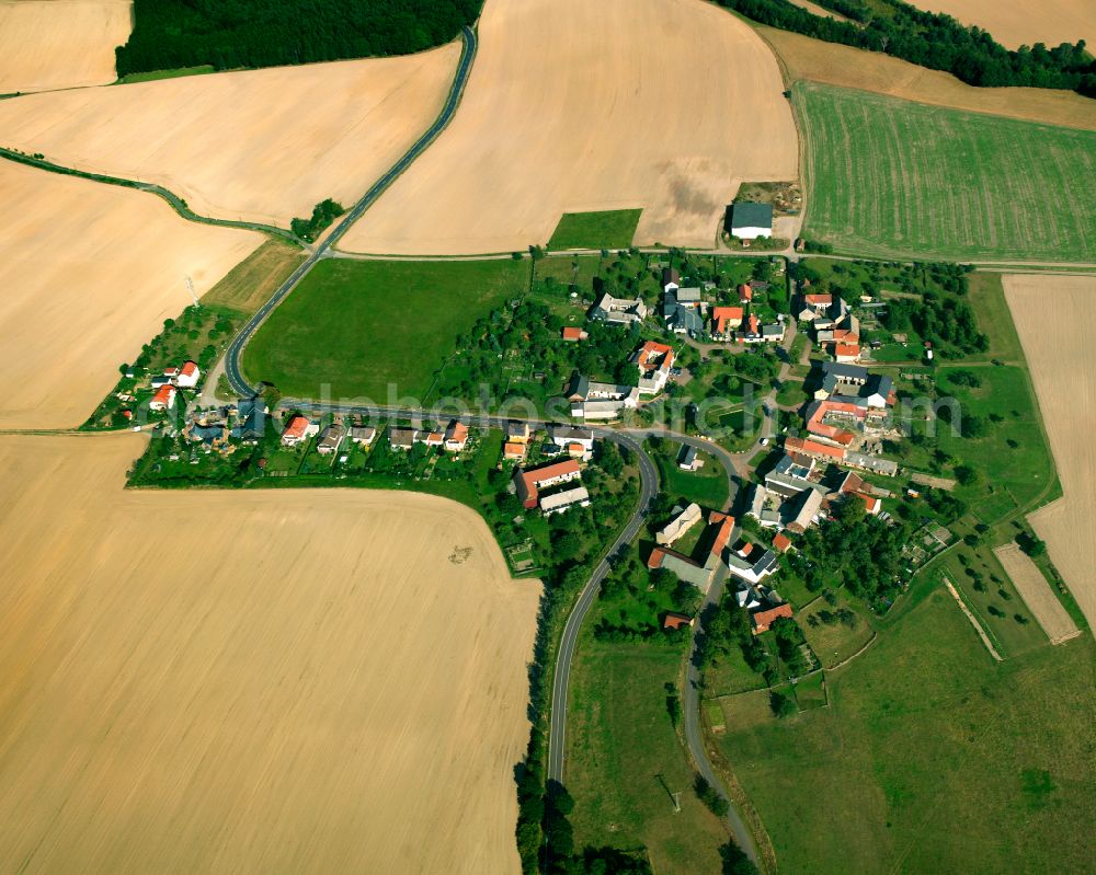 Zickra from above - Agricultural land and field boundaries surround the settlement area of the village in Zickra in the state Thuringia, Germany