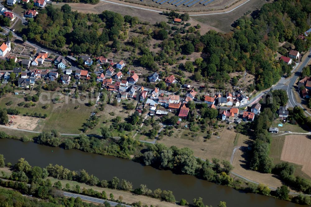 Zimmern from above - Agricultural land and field boundaries surround the settlement area of the village in Zimmern in the state Bavaria, Germany