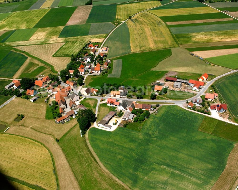 Zirndorf from above - Agricultural land and field boundaries surround the settlement area of the village in Zirndorf in the state Bavaria, Germany