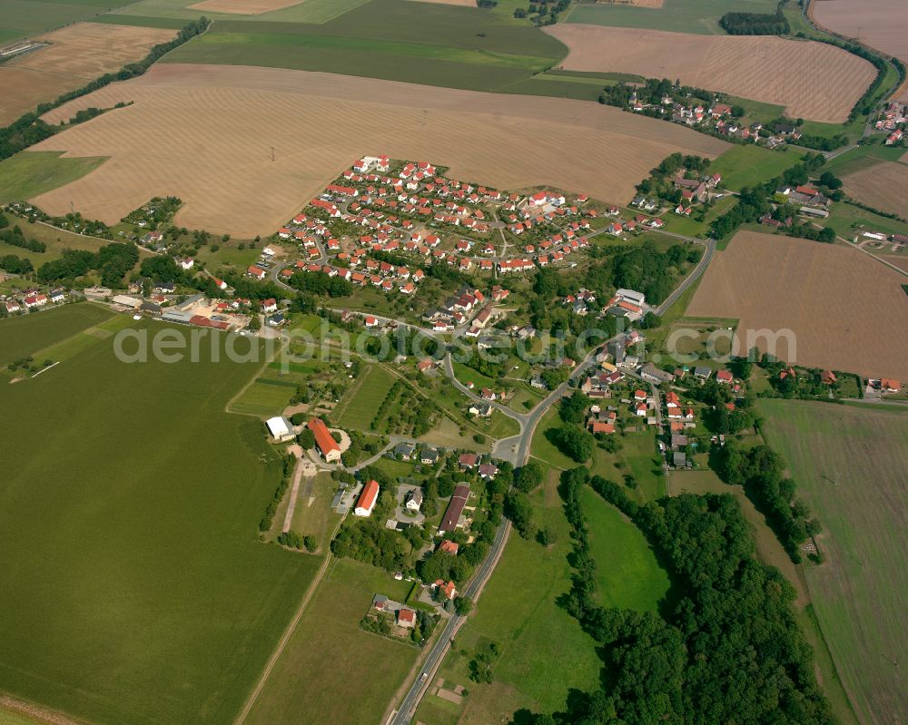 Zschippach from above - Agricultural land and field boundaries surround the settlement area of the village in Zschippach in the state Thuringia, Germany