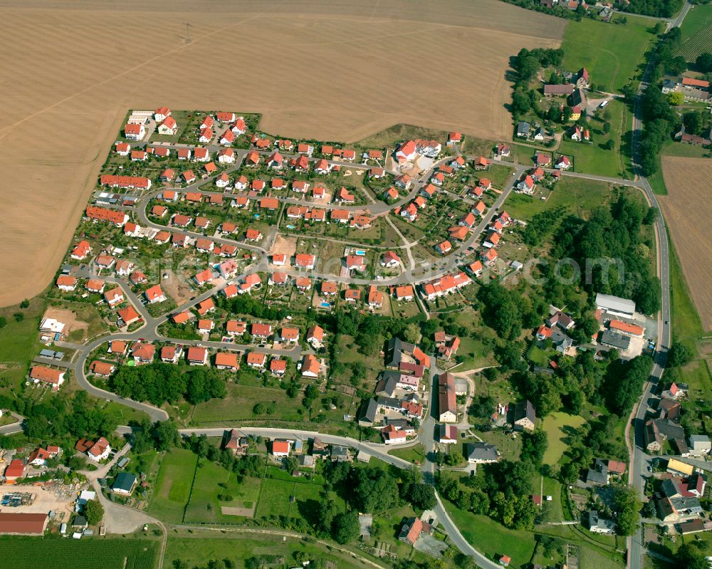 Zschippach from the bird's eye view: Agricultural land and field boundaries surround the settlement area of the village in Zschippach in the state Thuringia, Germany