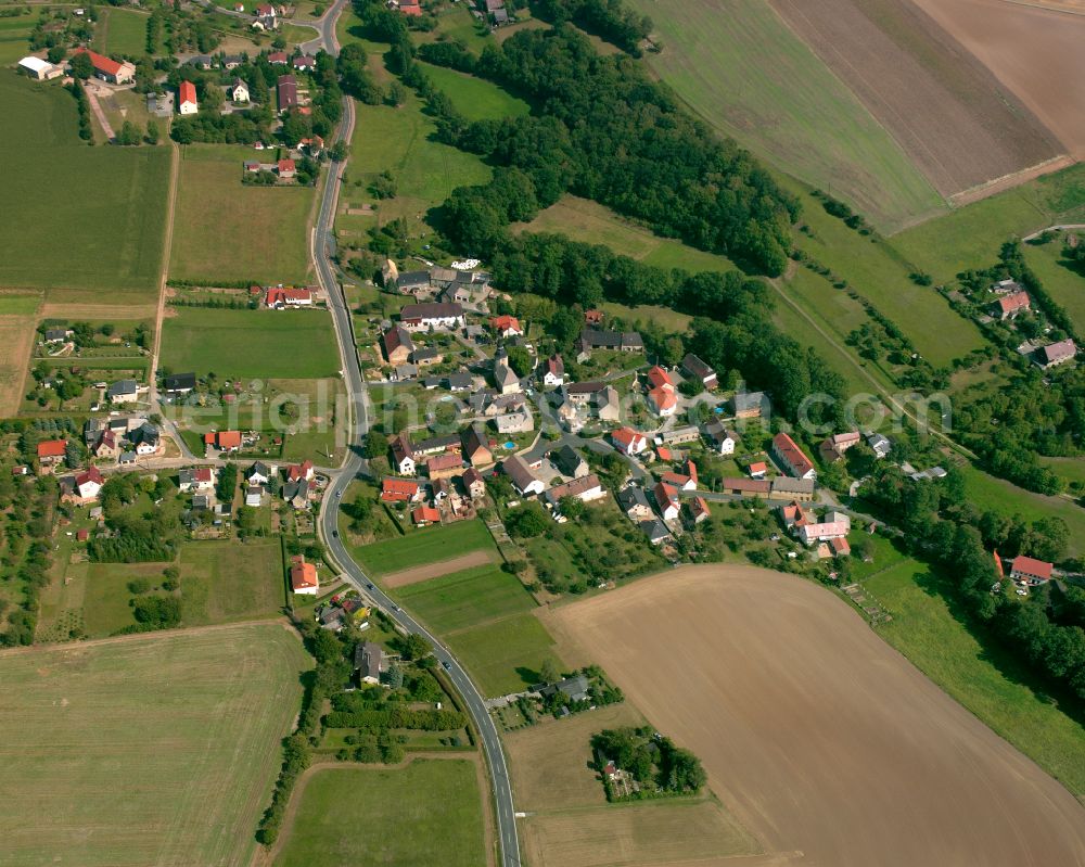 Zschippach from above - Agricultural land and field boundaries surround the settlement area of the village in Zschippach in the state Thuringia, Germany