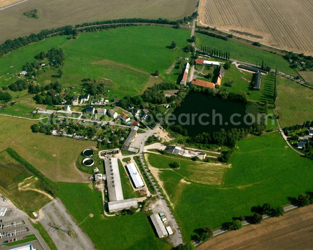 Zug from above - Agricultural land and field boundaries surround the settlement area of the village in Zug in the state Saxony, Germany