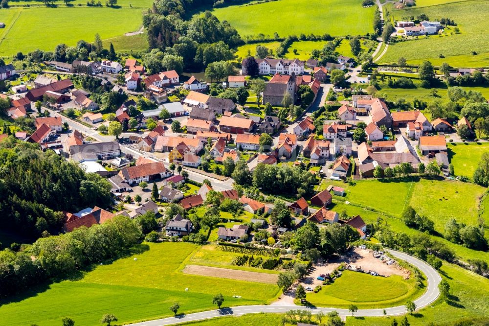 Aerial photograph Flechtdorf - Agricultural land and field borders surround the settlement area of the village in Flechtdorf in the state Hesse, Germany