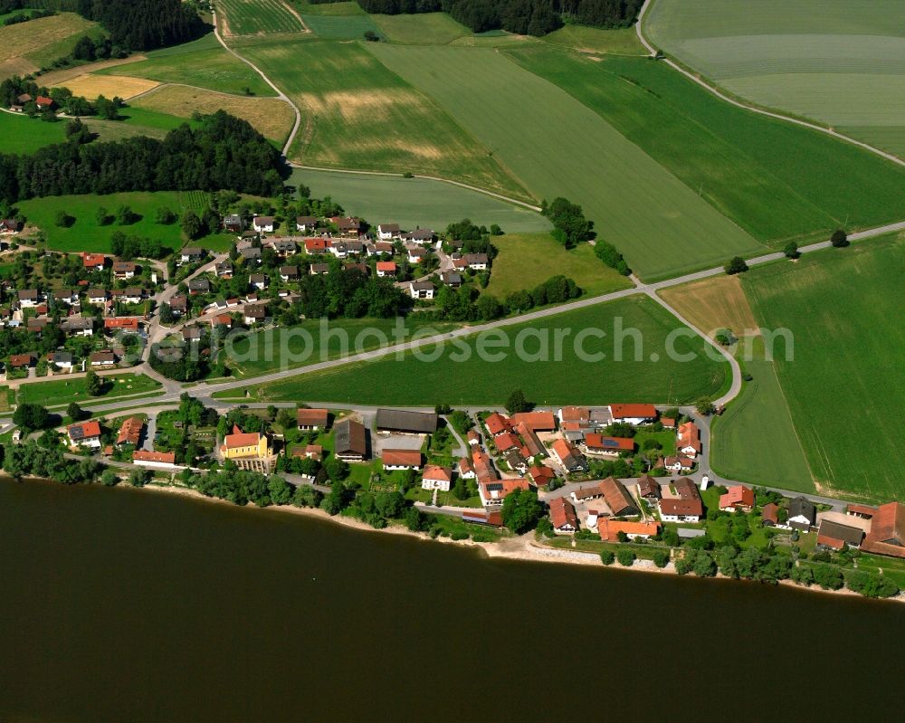 Pfelling from the bird's eye view: Village on the river bank areas of the river Danube in Pfelling in the state Bavaria, Germany