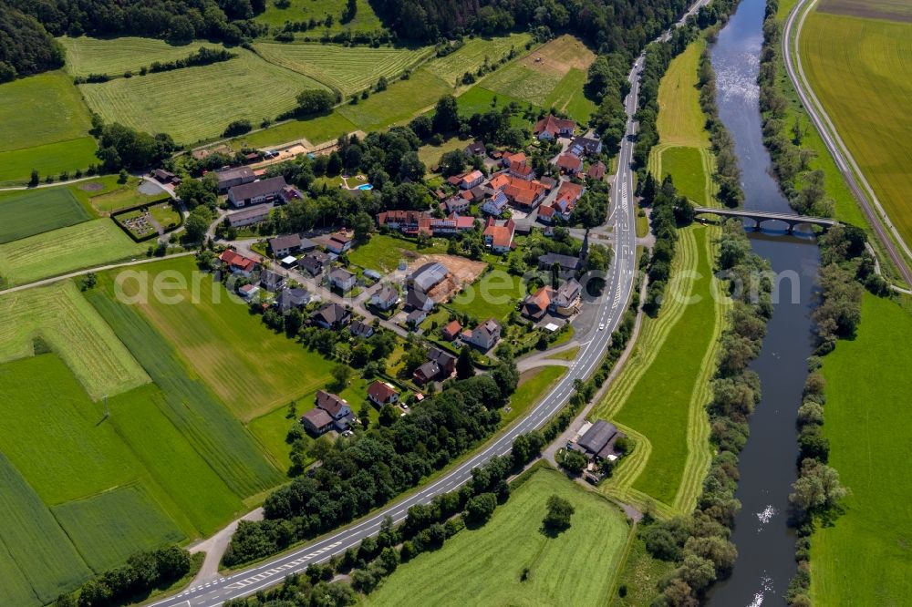 Kirchlotheim from the bird's eye view: Village on the river bank areas of Eder in Kirchlotheim in the state Hesse, Germany