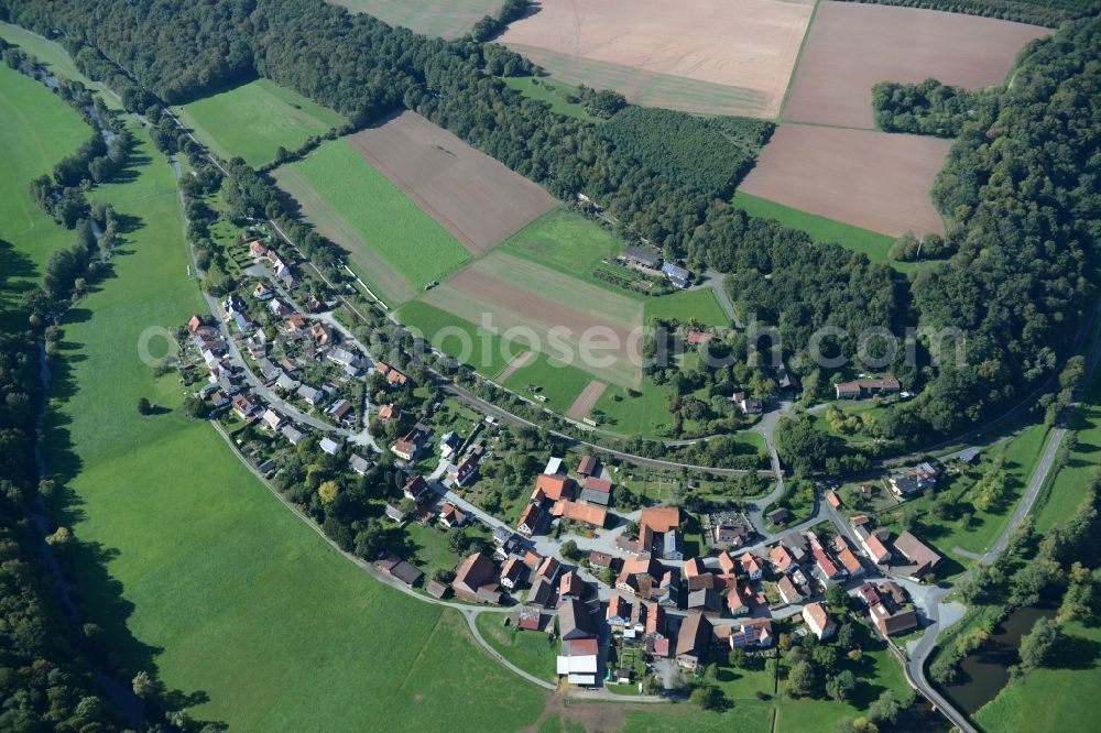 Hammelburg from the bird's eye view: Village on the river bank areas of Fraenkische Saale in Morlesau in the state Bavaria