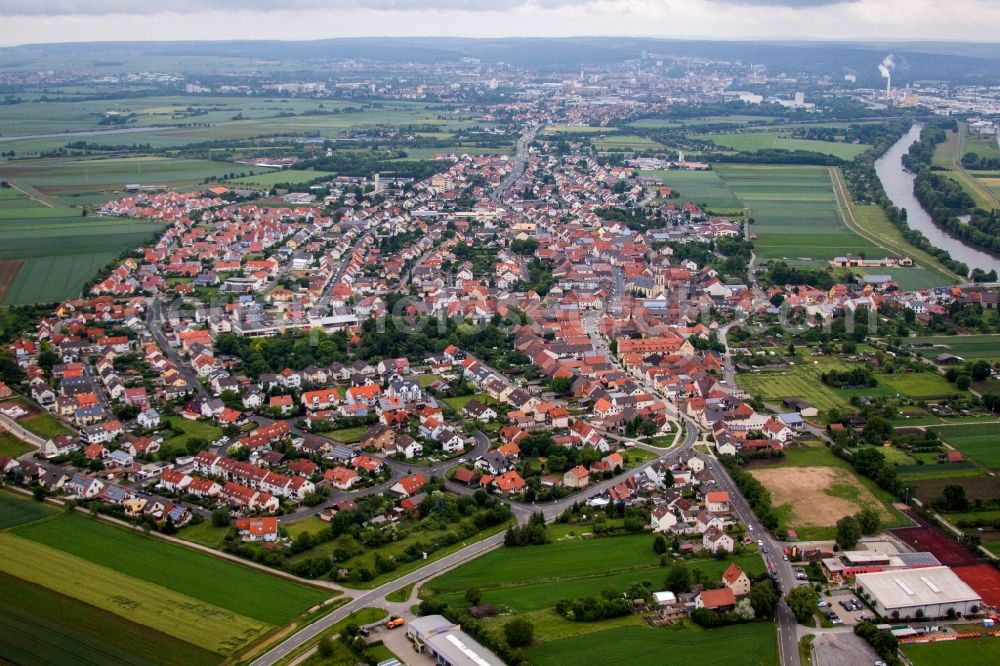 Bergrheinfeld from the bird's eye view: Village on the river bank areas of the Main river in Bergrheinfeld in the state Bavaria