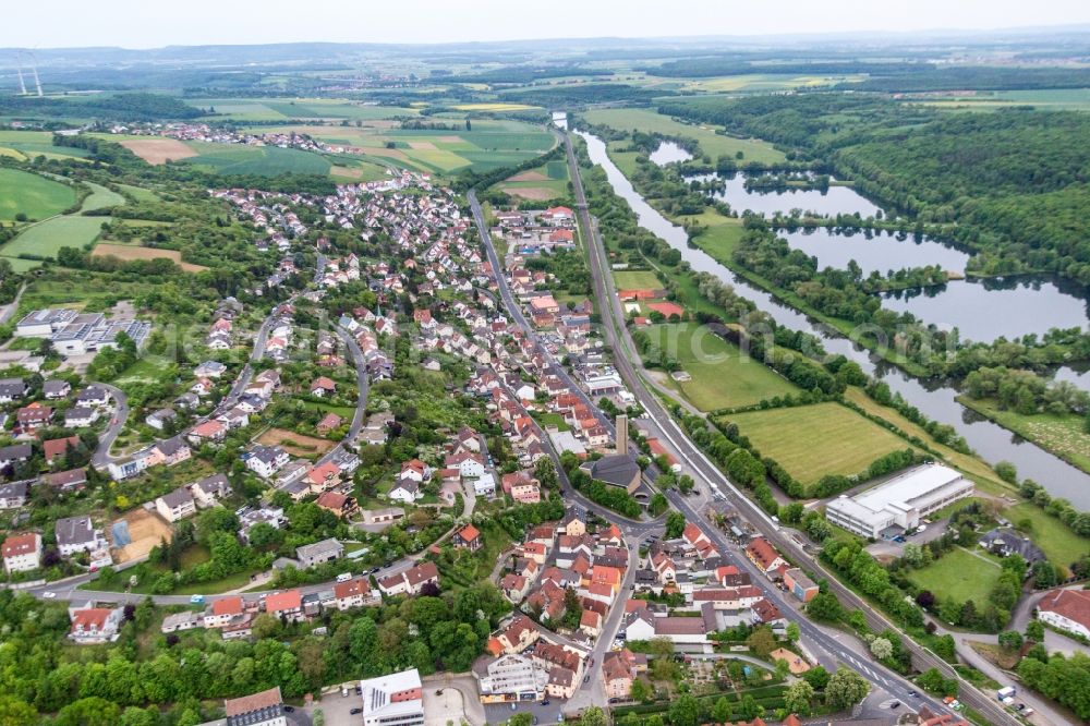 Schonungen from the bird's eye view: Village on the river bank areas of the Main river in Schonungen in the state Bavaria, Germany