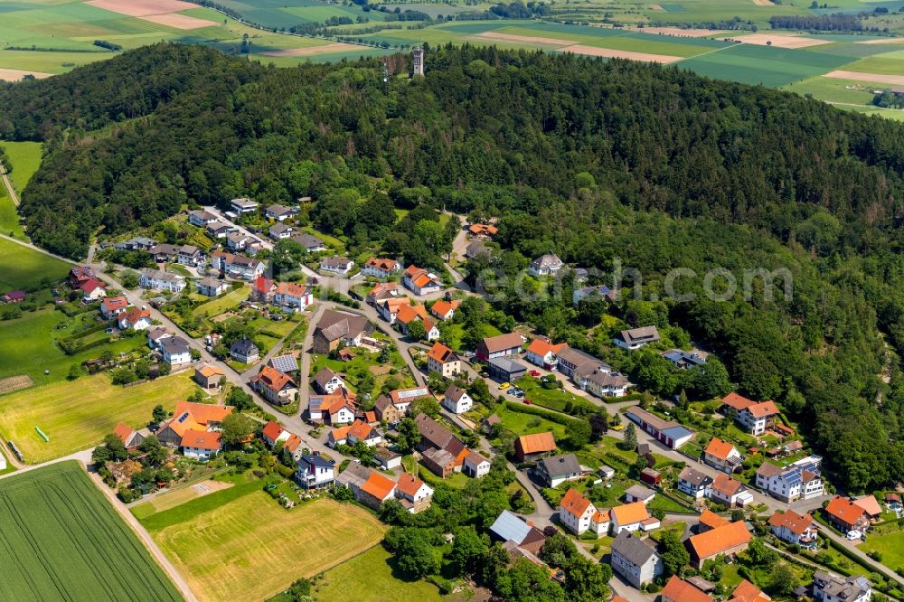 Goldhausen from the bird's eye view: Agricultural land and field borders surround the settlement area of the village in Goldhausen in the state Hesse, Germany