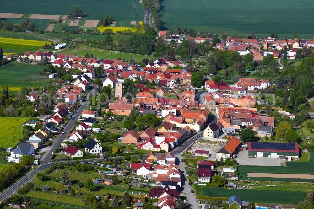 Aerial photograph Grabe - Agricultural land and field borders surround the settlement area of the village in Grabe in the state Thuringia, Germany