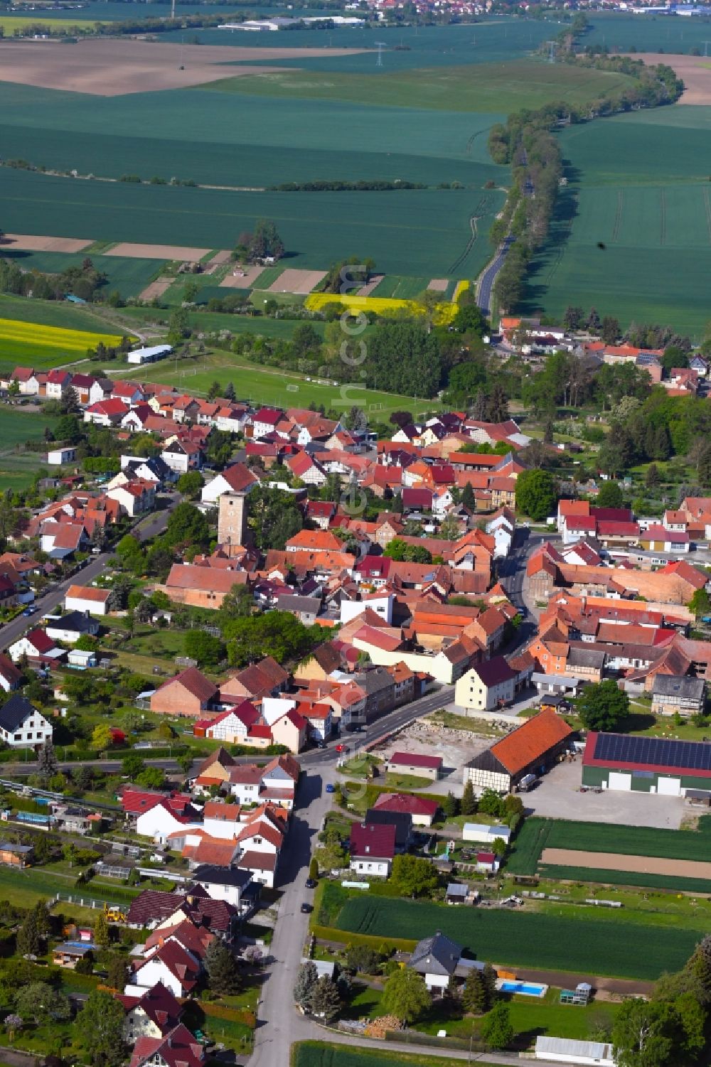 Grabe from the bird's eye view: Agricultural land and field borders surround the settlement area of the village in Grabe in the state Thuringia, Germany