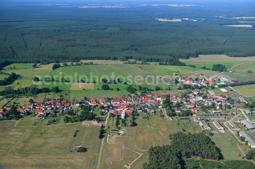 Aerial image Groß Briesen - Agricultural land and field borders surround the settlement area of the village in Gross Briesen in the state Brandenburg, Germany