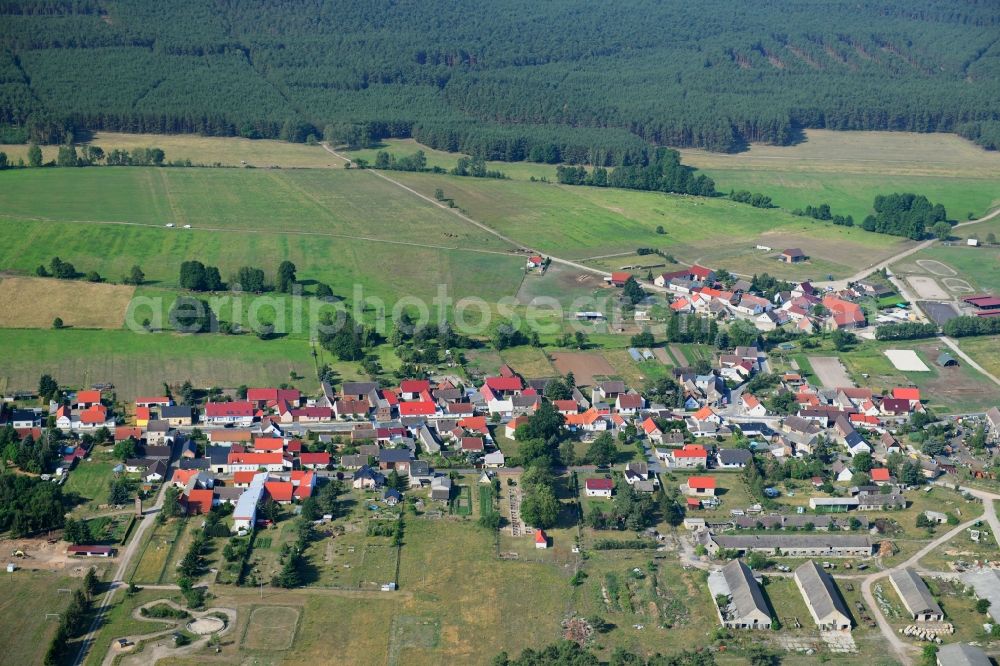 Aerial photograph Groß Briesen - Agricultural land and field borders surround the settlement area of the village in Gross Briesen in the state Brandenburg, Germany