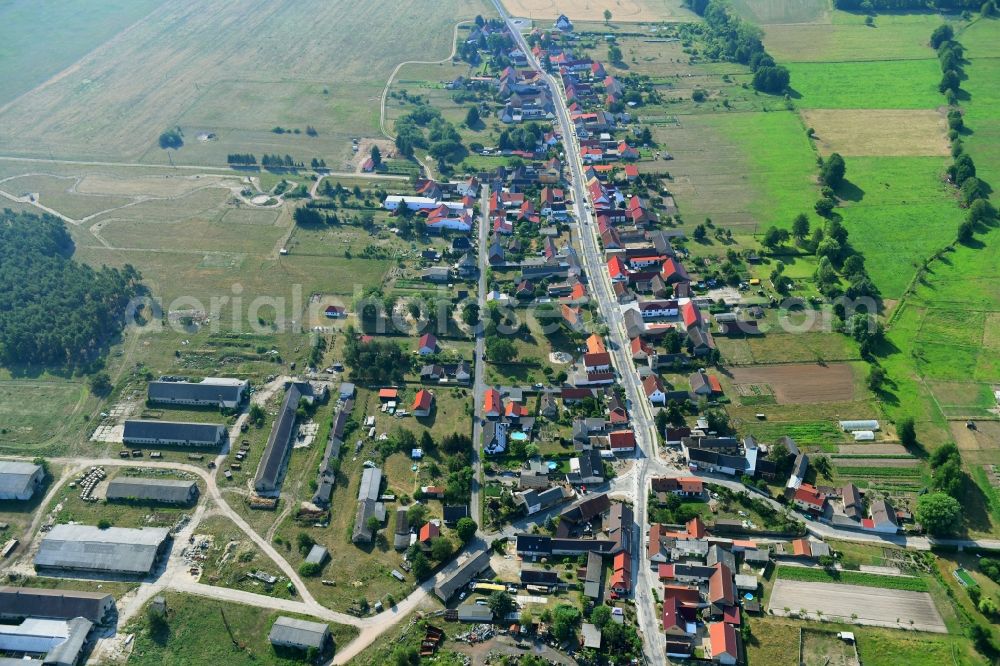 Aerial image Groß Briesen - Agricultural land and field borders surround the settlement area of the village in Gross Briesen in the state Brandenburg, Germany