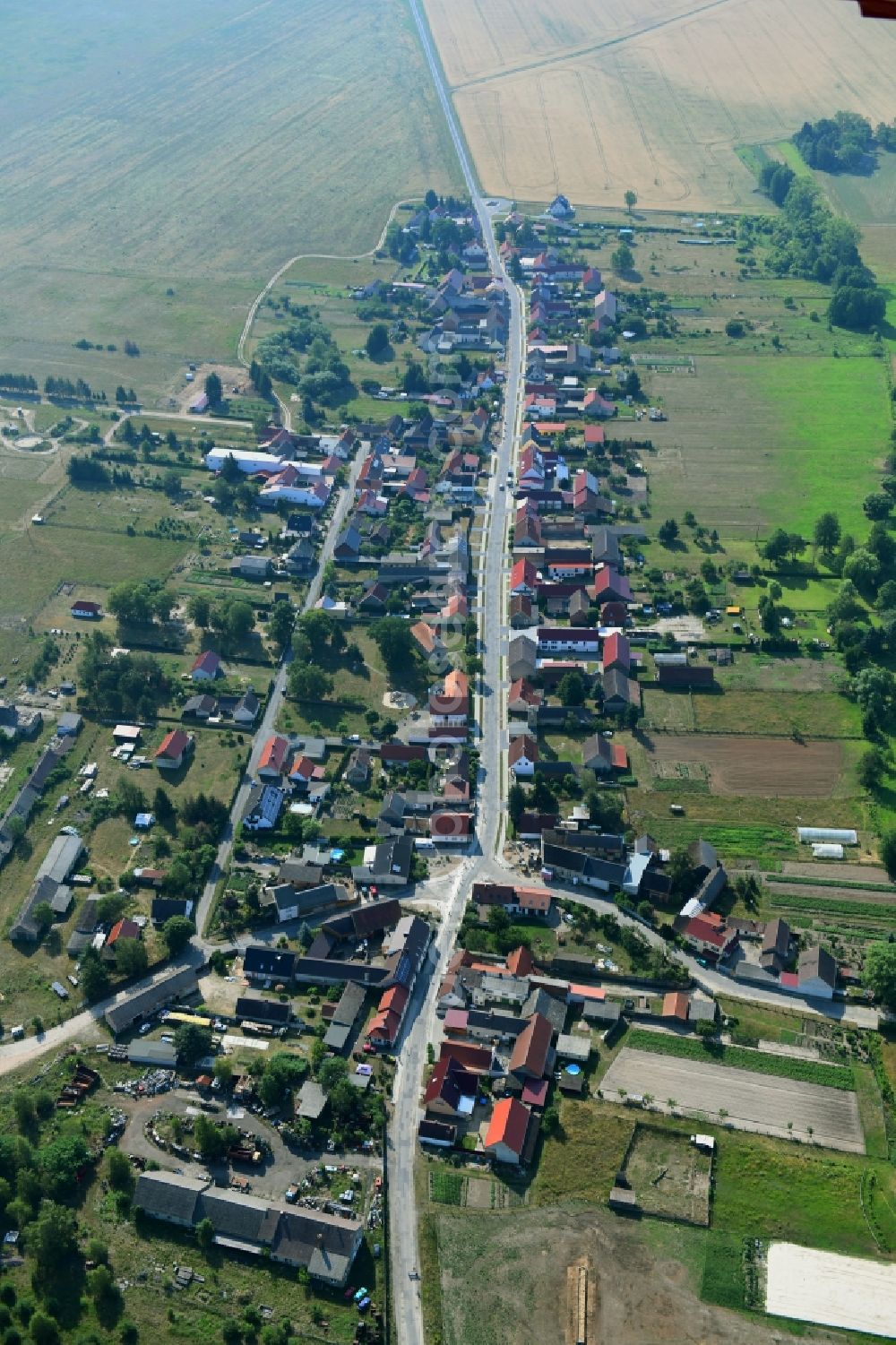 Aerial photograph Groß Briesen - Agricultural land and field borders surround the settlement area of the village in Gross Briesen in the state Brandenburg, Germany