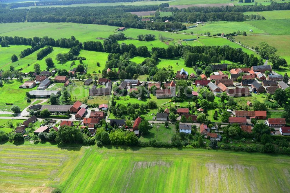 Aerial photograph Groß Leppin - Agricultural land and field borders surround the settlement area of the village in Gross Leppin in the state Brandenburg, Germany