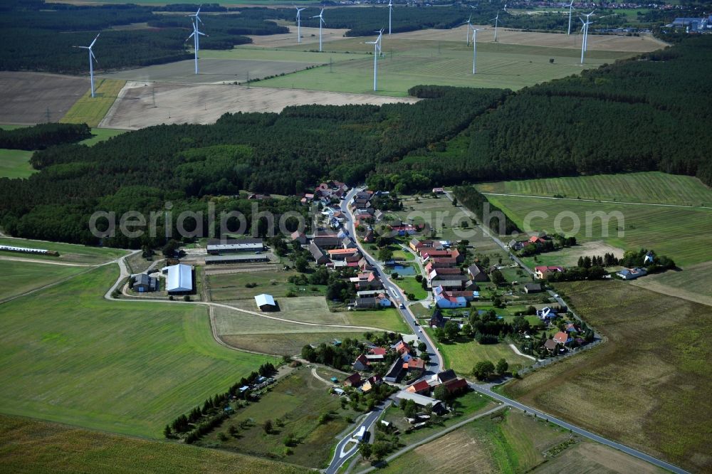 Haseloff from above - Agricultural land and field borders surround the settlement area of the village in Haseloff in the state Brandenburg, Germany