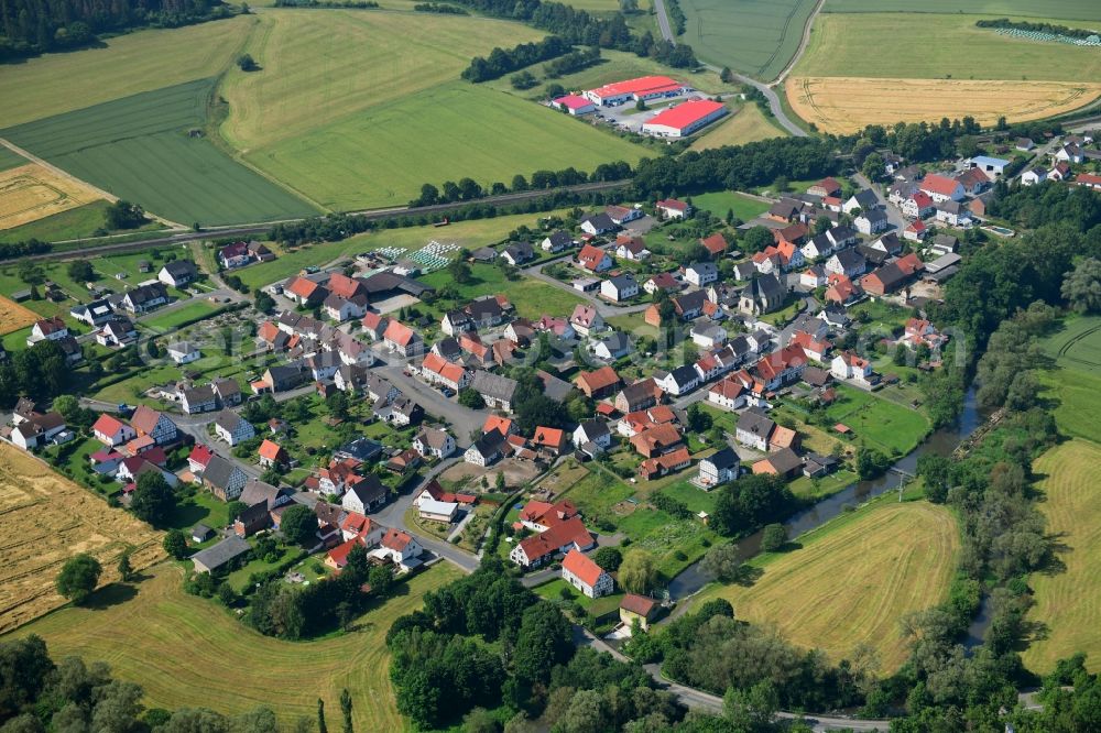 Aerial image Haueda - Agricultural land and field borders surround the settlement area of the village in Haueda in the state Hesse, Germany