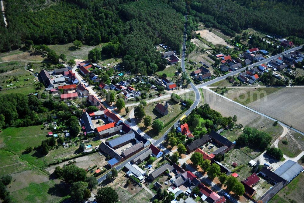 Hohenwerbig from above - Agricultural land and field borders surround the settlement area of the village in Hohenwerbig in the state Brandenburg, Germany