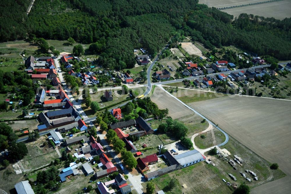 Aerial image Hohenwerbig - Agricultural land and field borders surround the settlement area of the village in Hohenwerbig in the state Brandenburg, Germany