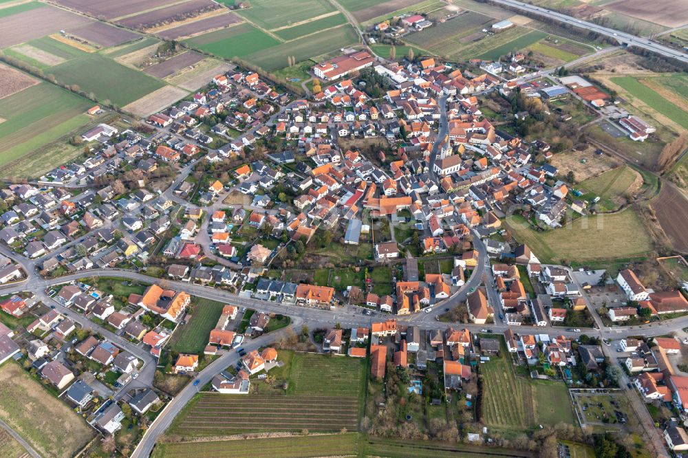 Aerial photograph Laumersheim - Agricultural land and field borders surround the settlement area of the village in Laumersheim in the state Rhineland-Palatinate, Germany