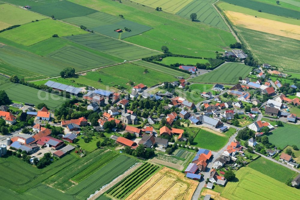 Aerial photograph Löwen - Agricultural land and field borders surround the settlement area of the village in Loewen in the state North Rhine-Westphalia, Germany