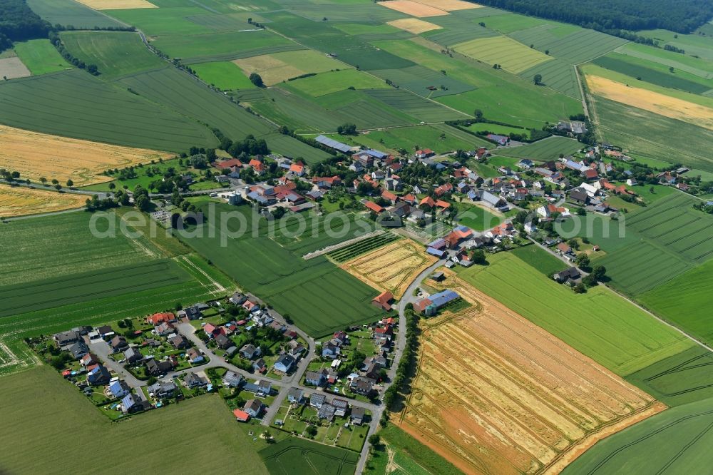 Löwen from the bird's eye view: Agricultural land and field borders surround the settlement area of the village in Loewen in the state North Rhine-Westphalia, Germany