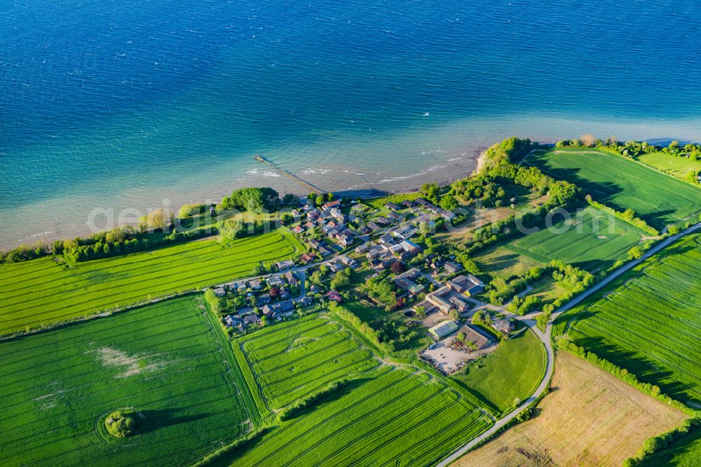 Quern from the bird's eye view: Village on marine coastal area of Nieby on street Neukirchen in Quern in the state Schleswig-Holstein, Germany