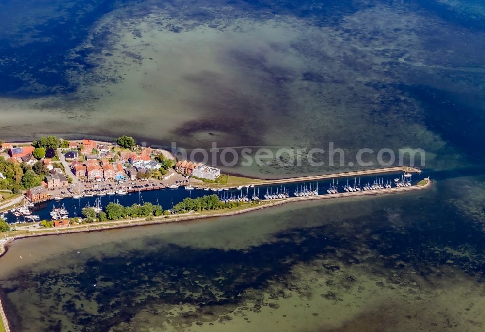 Fehmarn from above - Village center on the coastal area of the Baltic Sea in Orth auf Fehmarn in the state Schleswig-Holstein, Germany. The port and fishing village is located on the Orth Bay in the western part of the island of Fehmarn