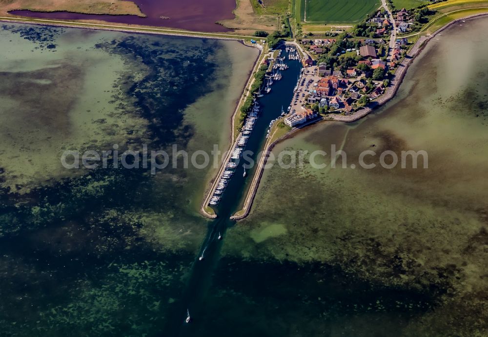 Aerial image Fehmarn - Village center on the coastal area of the Baltic Sea in Orth auf Fehmarn in the state Schleswig-Holstein, Germany. The port and fishing village is located on the Orth Bay in the western part of the island of Fehmarn