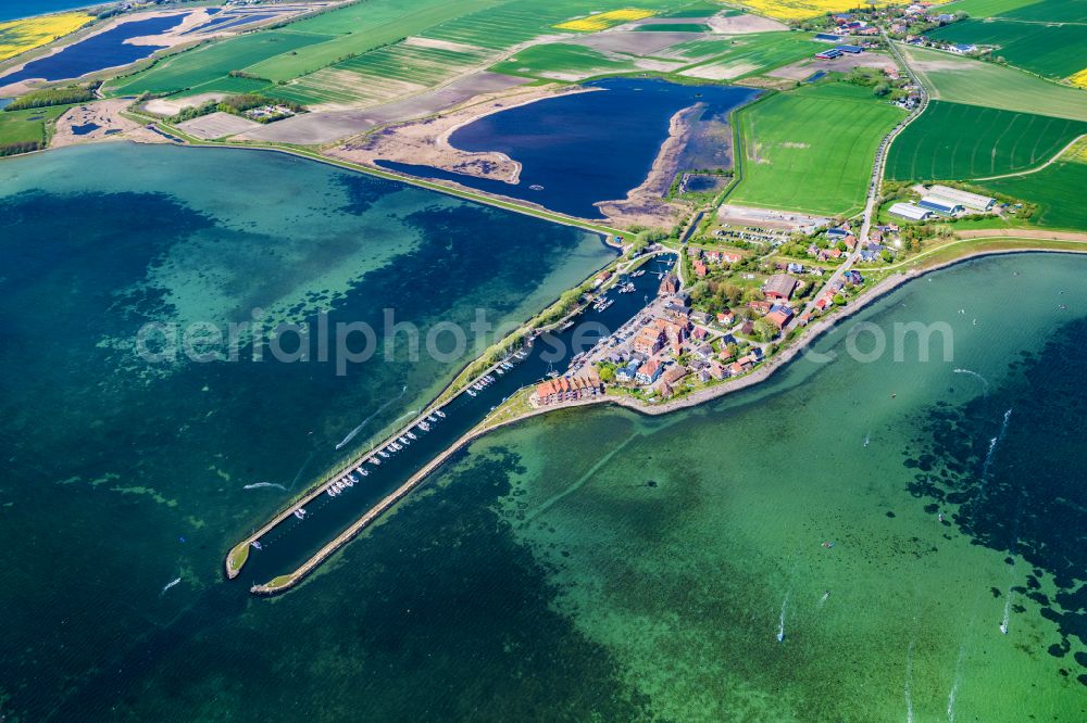 Aerial image Fehmarn - Village center on the coastal area of the Baltic Sea in Orth auf Fehmarn in the state Schleswig-Holstein, Germany. The port and fishing village is located on the Orth Bay in the western part of the island of Fehmarn