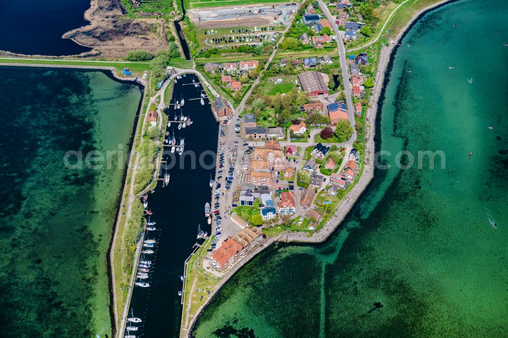 Fehmarn from above - Village center on the coastal area of the Baltic Sea in Orth auf Fehmarn in the state Schleswig-Holstein, Germany. The port and fishing village is located on the Orth Bay in the western part of the island of Fehmarn