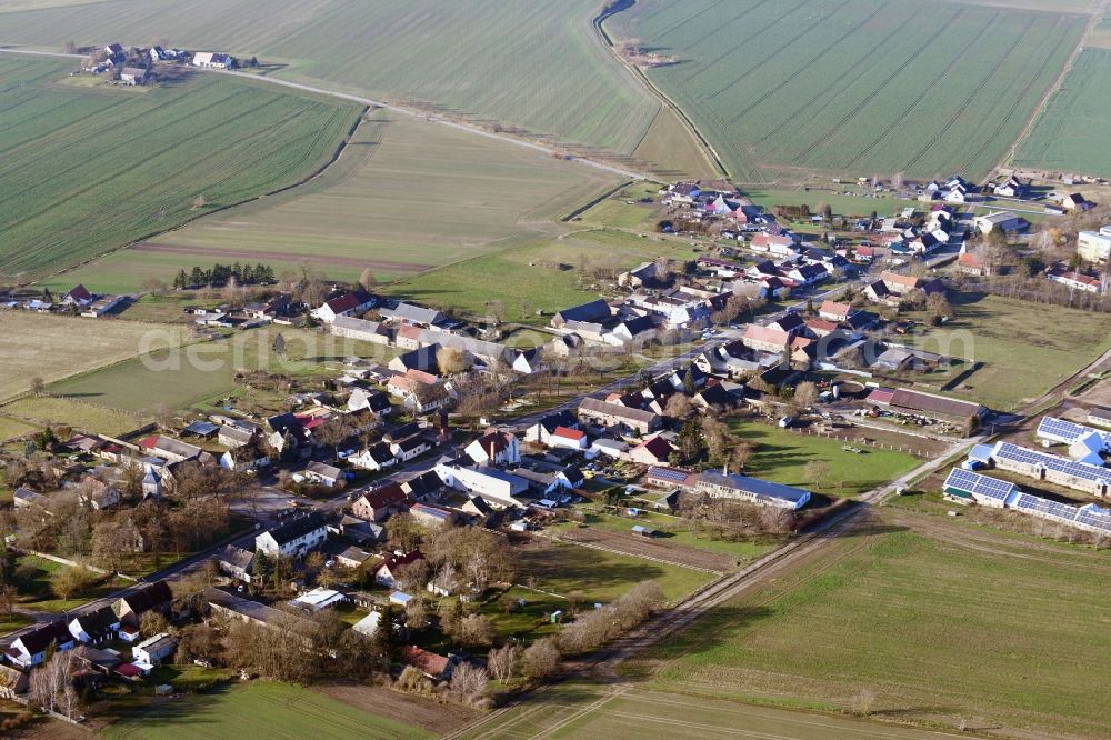 Aerial photograph Mildenberg - Agricultural land and field borders surround the settlement area of the village in Mildenberg in the state Brandenburg, Germany