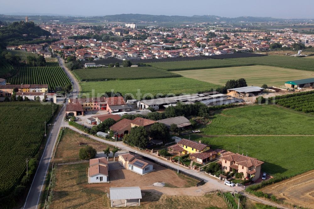 Nadalini from above - Agricultural land and field borders surround the settlement area of the village in Nadalini in Veneto, Italy