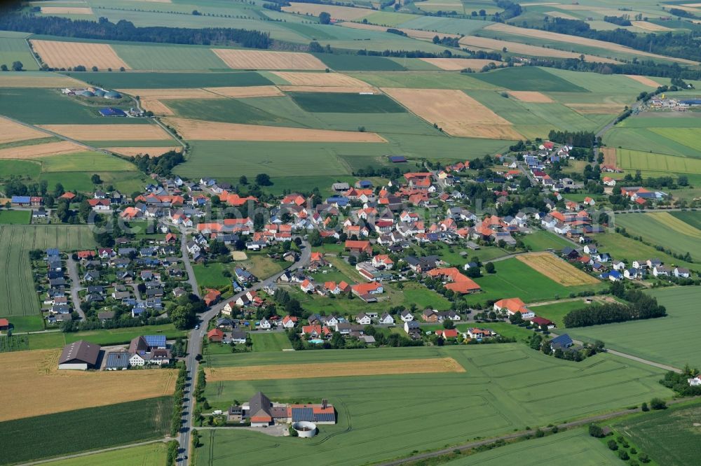 Aerial image Natzungen - Agricultural land and field borders surround the settlement area of the village in Natzungen in the state North Rhine-Westphalia, Germany