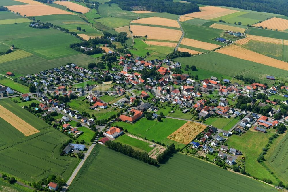 Aerial photograph Natzungen - Agricultural land and field borders surround the settlement area of the village in Natzungen in the state North Rhine-Westphalia, Germany