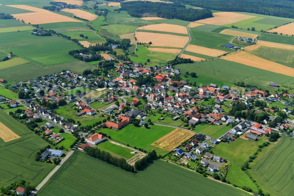 Natzungen from above - Agricultural land and field borders surround the settlement area of the village in Natzungen in the state North Rhine-Westphalia, Germany