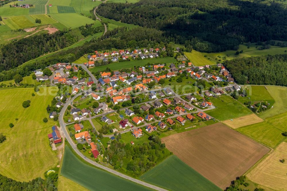 Aerial image Obernburg - Agricultural land and field borders surround the settlement area of the village in Obernburg in the state Hesse, Germany