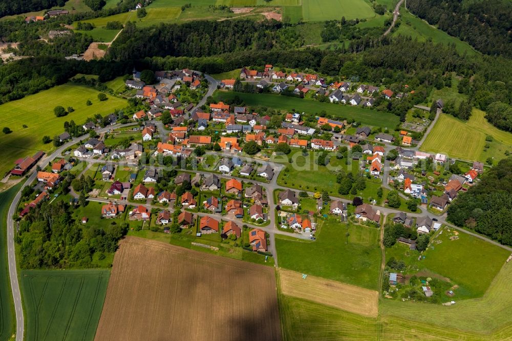 Aerial image Obernburg - Agricultural land and field borders surround the settlement area of the village in Obernburg in the state Hesse, Germany