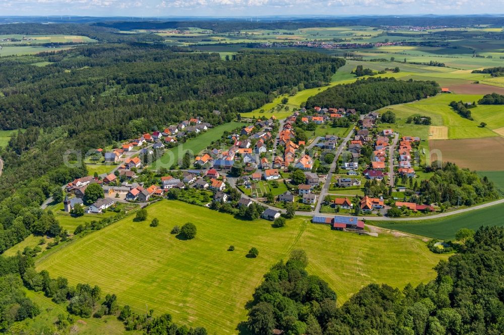 Aerial image Obernburg - Agricultural land and field borders surround the settlement area of the village in Obernburg in the state Hesse, Germany