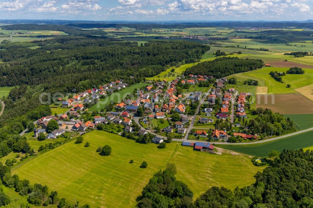 Aerial photograph Obernburg - Agricultural land and field borders surround the settlement area of the village in Obernburg in the state Hesse, Germany