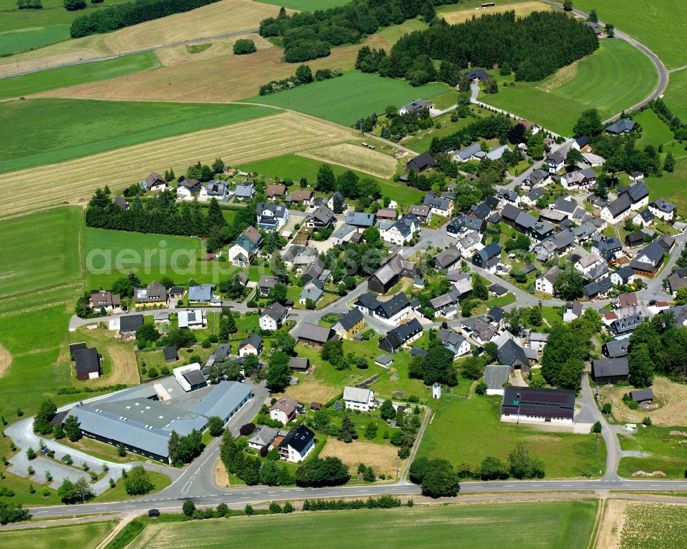 Aerial image Carlsgrün - Agricultural land and field boundaries with the power plants surround the settlement area of the village in Carlsgrün in the state Bavaria, Germany