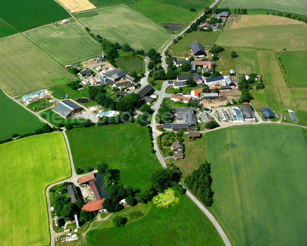 Döberlitz from above - Agricultural land and field boundaries with the power plants surround the settlement area of the village in Döberlitz in the state Bavaria, Germany