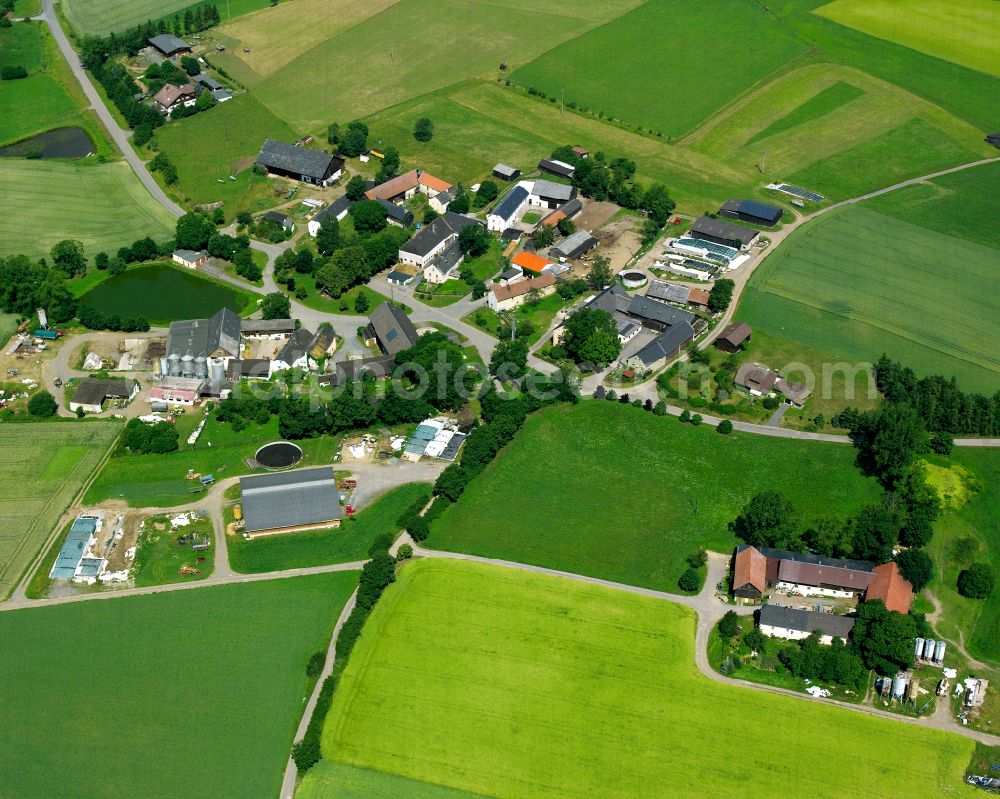 Döberlitz from the bird's eye view: Agricultural land and field boundaries with the power plants surround the settlement area of the village in Döberlitz in the state Bavaria, Germany