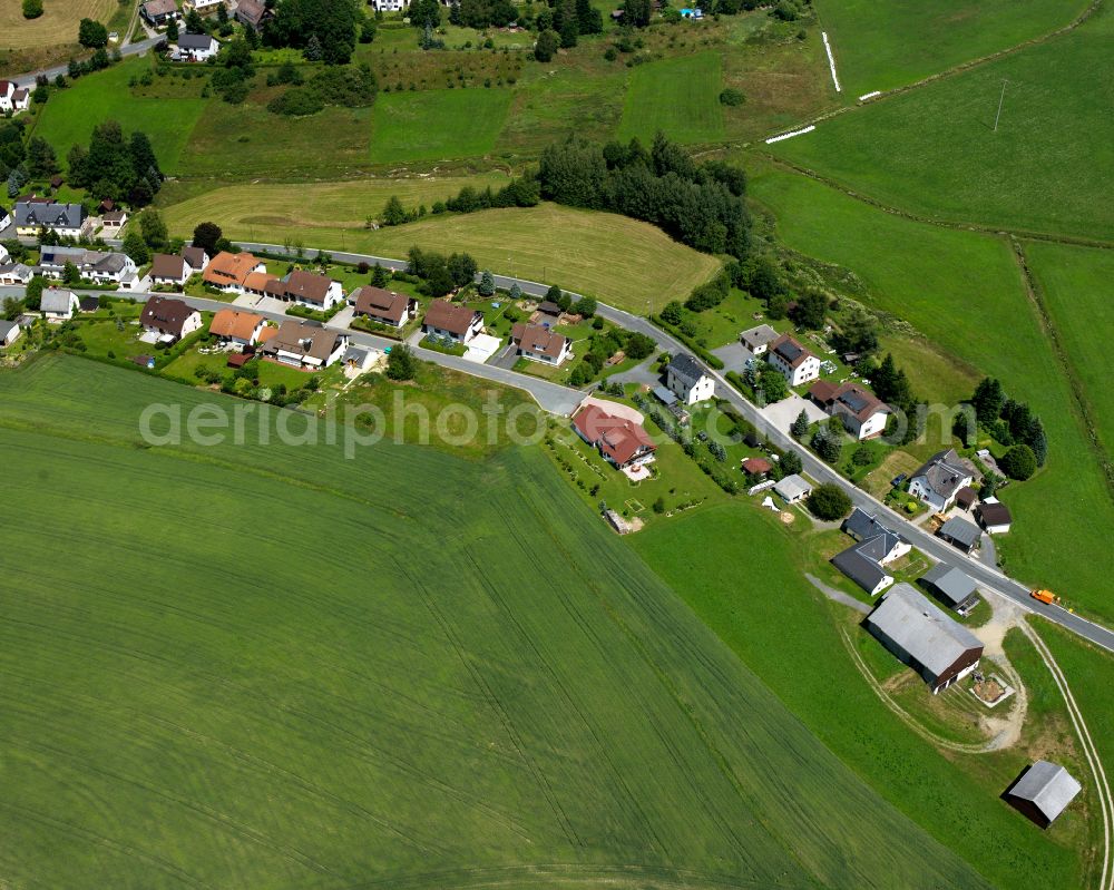 Aerial photograph Geroldsgrün - Agricultural land and field boundaries with the power plants surround the settlement area of the village in Geroldsgrün in the state Bavaria, Germany