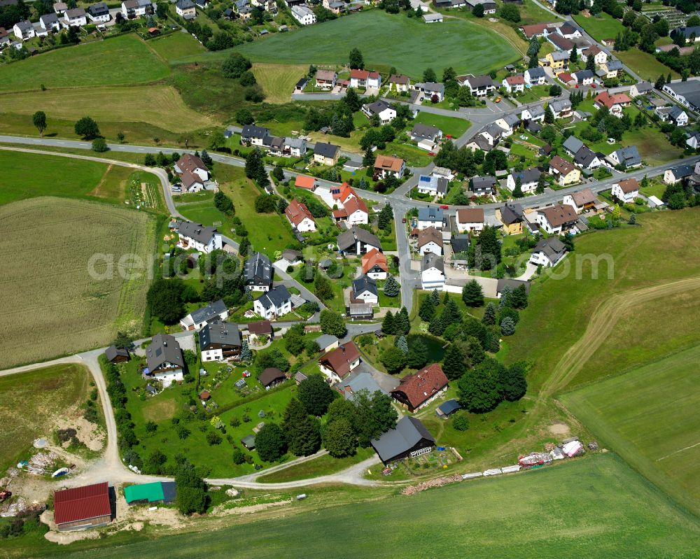 Geroldsgrün from above - Agricultural land and field boundaries with the power plants surround the settlement area of the village in Geroldsgrün in the state Bavaria, Germany